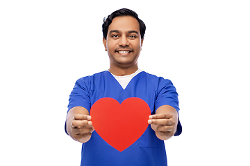 Image showing smiling male doctor with red heart on clipboard