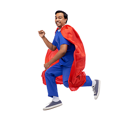 Image showing doctor or male nurse in superhero cape jumping