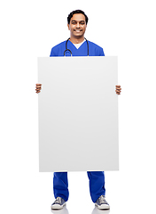 Image showing smiling male doctor or nurse with big white board