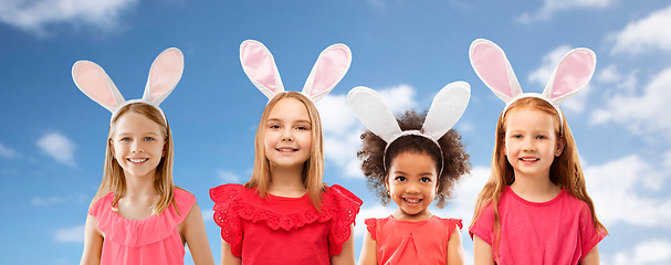 Image showing happy girls wearing easter bunny ears headbands