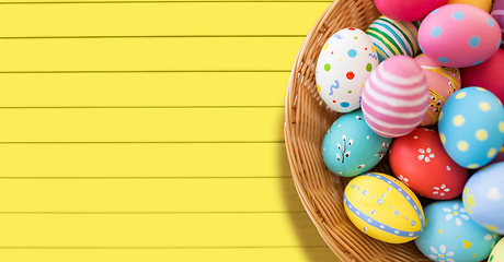 Image showing close up of colored easter eggs in basket