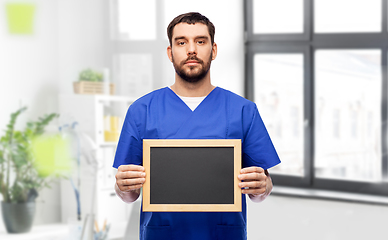 Image showing male doctor or nurse with chalkboard