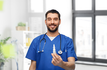 Image showing doctor or male nurse with medicine and stethoscope