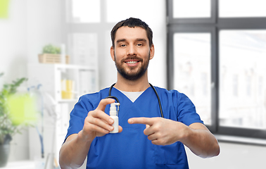 Image showing doctor or male nurse with medicine and stethoscope