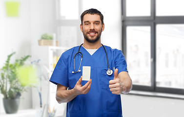 Image showing male doctor with medicine showing thumbs up