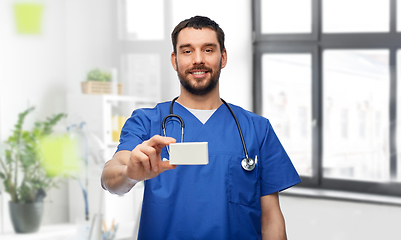 Image showing doctor or male nurse with medicine and stethoscope