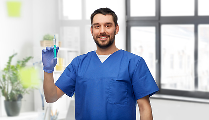 Image showing doctor or male nurse with medicine in syringe