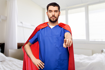 Image showing male doctor in superhero cape pointing to you