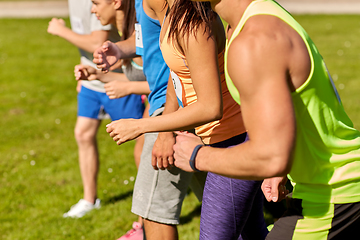 Image showing sportsmen with badge numbers on start of race