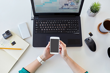 Image showing woman smartphone and laptop working at home