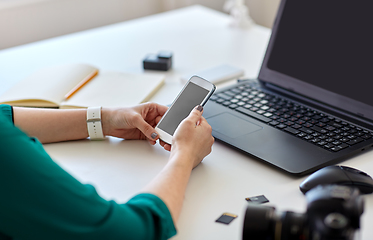 Image showing woman smartphone and laptop working at home