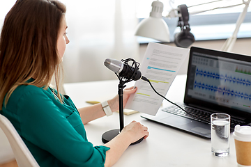 Image showing woman with microphone recording podcast at studio