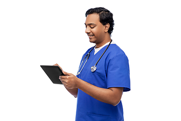 Image showing smiling doctor or male nurse using tablet computer