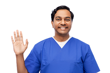 Image showing happy indian doctor or male nurse waving hand