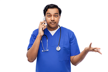 Image showing indian doctor or male nurse calling on smartphone