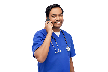 Image showing smiling doctor or male nurse calling on smartphone