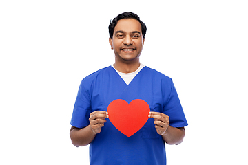 Image showing smiling male doctor with red heart on clipboard