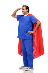 Image showing smiling doctor or male nurse in superhero cape