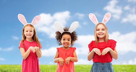 Image showing happy girls wearing easter bunny ears headbands