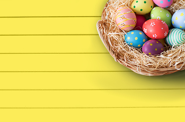 Image showing close up of colored easter eggs in basket