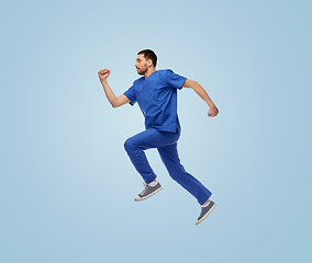 Image showing doctor or male nurse jumping in air