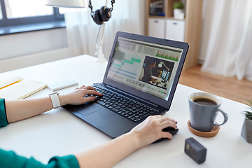 Image showing woman with video editor program on laptop at home