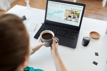 Image showing woman with video editor program on laptop at home