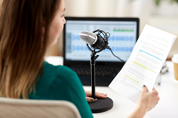 Image showing woman with microphone recording podcast at studio