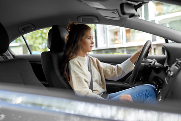 Image showing woman or female driver driving car in city