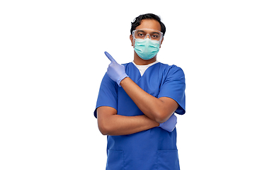 Image showing indian male doctor in mask showing something