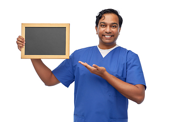 Image showing happy indian male doctor or nurse with chalkboard