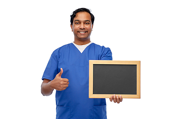 Image showing happy indian male doctor or nurse with chalkboard