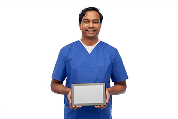 Image showing happy doctor or male nurse showing tablet computer