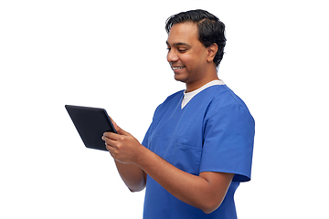 Image showing smiling doctor or male nurse using tablet computer