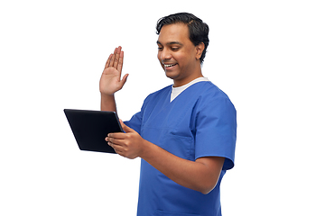 Image showing doctor or male nurse has video call on tablet pc