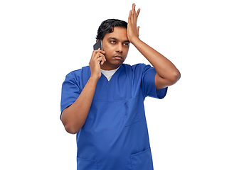 Image showing indian doctor or male nurse calling on smartphone