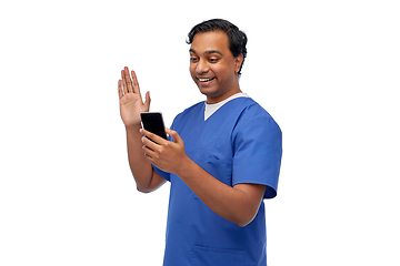 Image showing doctor or male nurse having video call on phone