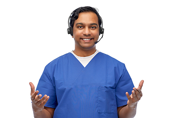 Image showing smiling indian doctor or male nurse with headset