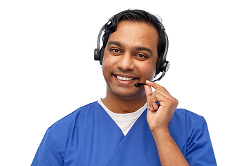 Image showing smiling indian doctor or male nurse with headset