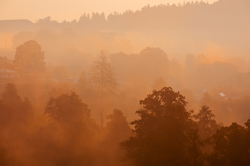 Image showing Autumn foggy sunrise landscape