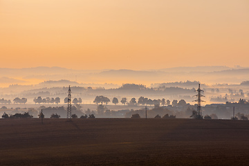 Image showing Autumn foggy sunrise landscape