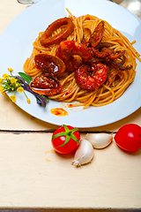 Image showing Italian seafood spaghetti pasta on red tomato sauce