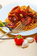 Image showing Italian seafood spaghetti pasta on red tomato sauce