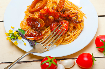 Image showing Italian seafood spaghetti pasta on red tomato sauce