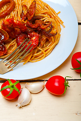 Image showing Italian seafood spaghetti pasta on red tomato sauce