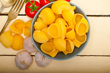 Image showing Italian snail lumaconi pasta with tomatoes