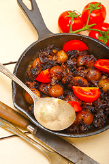 Image showing Baby cuttle fish roasted on iron skillet