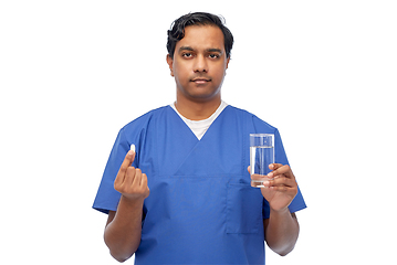 Image showing indian doctor with medicine and glass of water