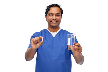 Image showing indian doctor with medicine and glass of water