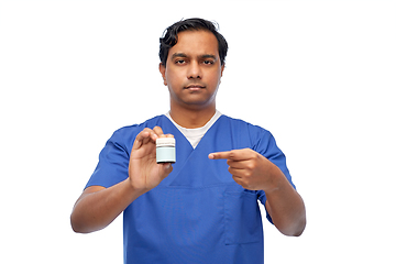 Image showing indian doctor or male nurse holding medicine